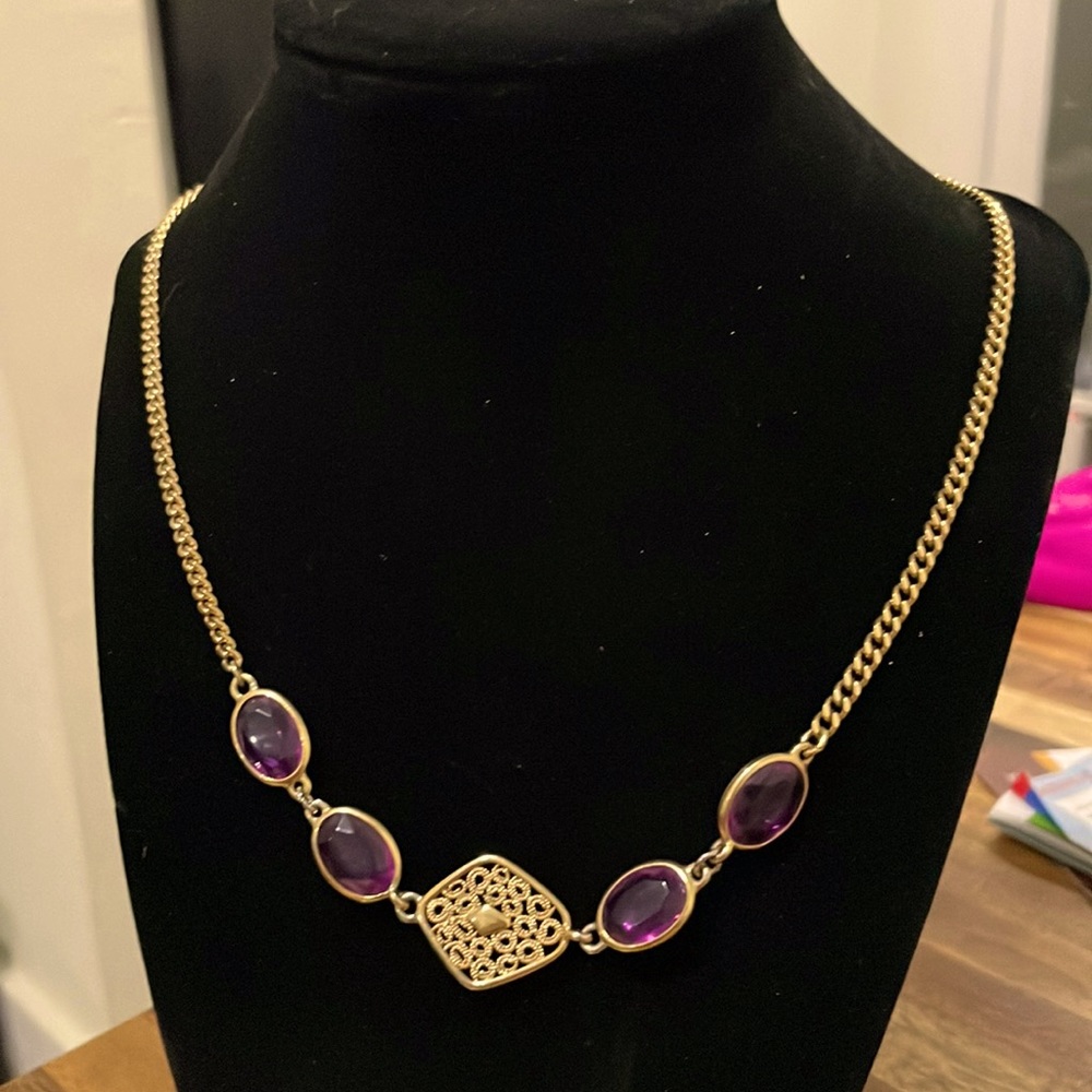 Sarah Cov gold tone necklace. Amethyst colored stones